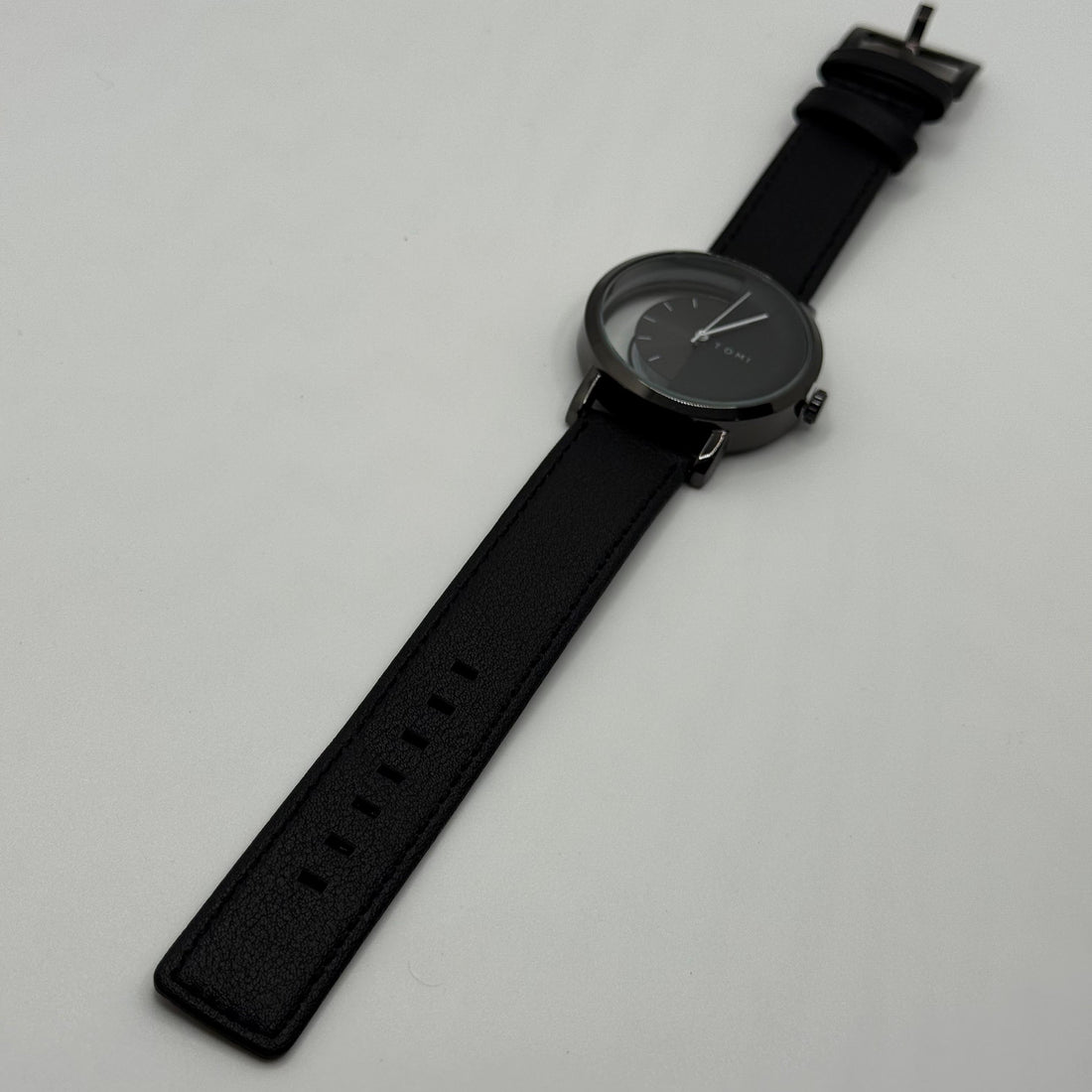 TOMI transparent dial with black leather strap
